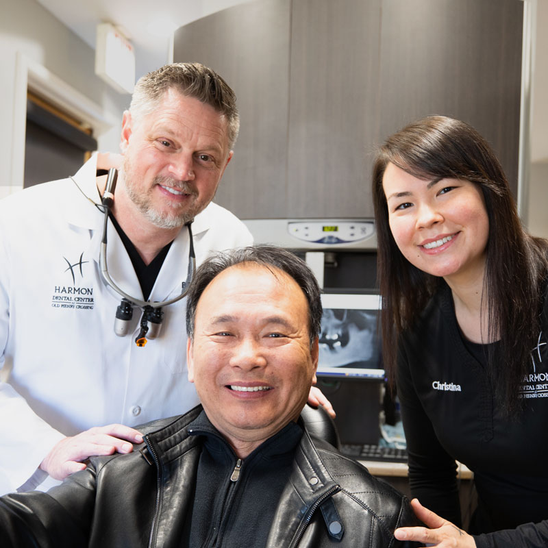 Dr. Brad Harmon Smiling With A Dental Patient After Their All On 4 Dental Implant Surgery