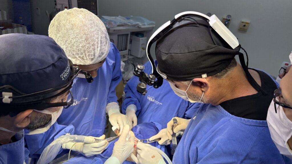 Dental surgeons perform advanced zygomatic implant surgery during hands-on training at the Transnasal Zygoma Residency in Brazil.