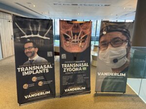 Banners at the Transnasal Zygoma Residency in Brazil featuring Professor Vanderlim and advanced zygomatic implant techniques.