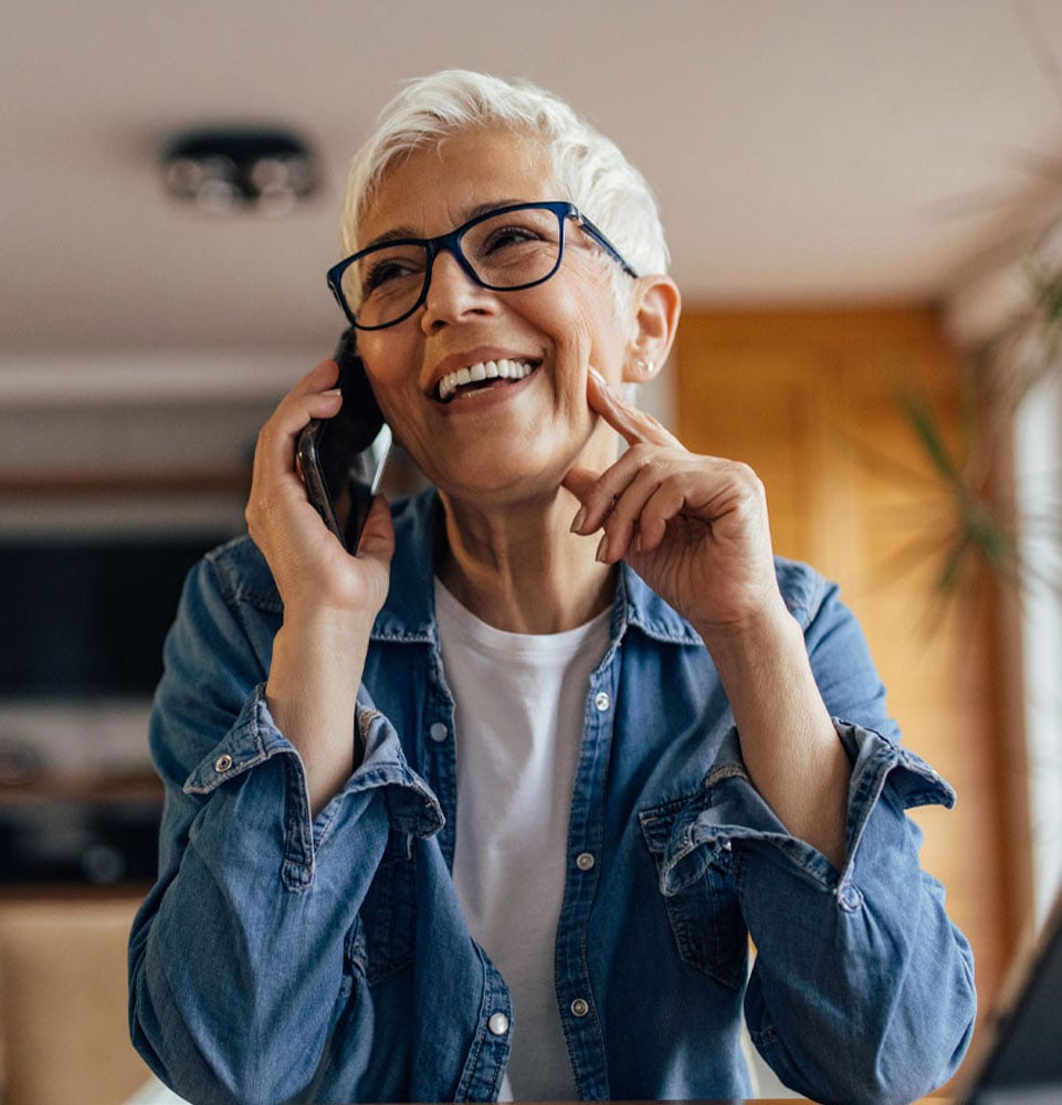Smiling patient calling Harmon Dental Center